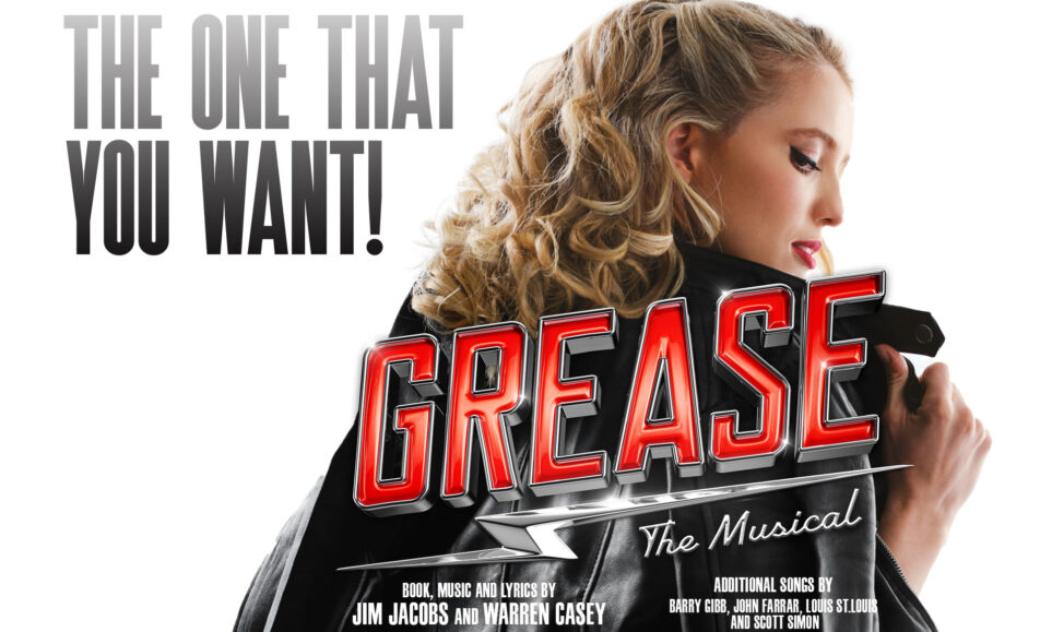 Promotional poster for "Grease: The Musical" featuring a woman in a leather jacket with curly blonde hair. The text reads "The One That You Want!" and includes credits for the book, music, and lyrics by Jim Jacobs and Warren Casey, along with promotional details for the Christmas in July 3-Course Lunch at Secrets on the Lake | 18 JULY 2024.